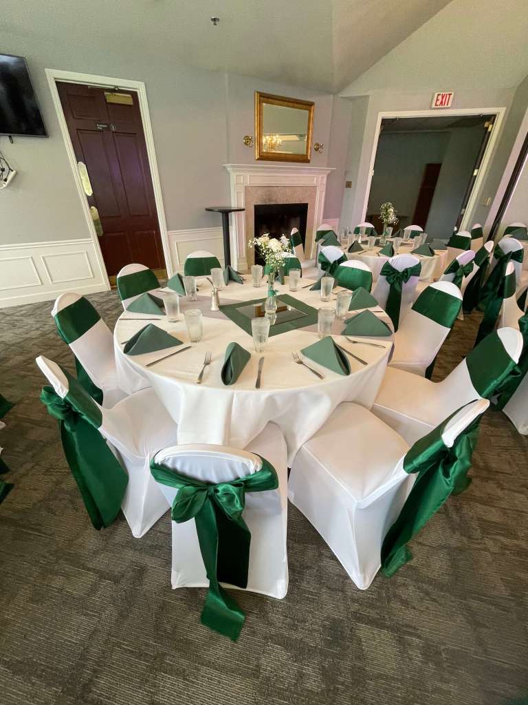green seat drapery and napkins on banquet table